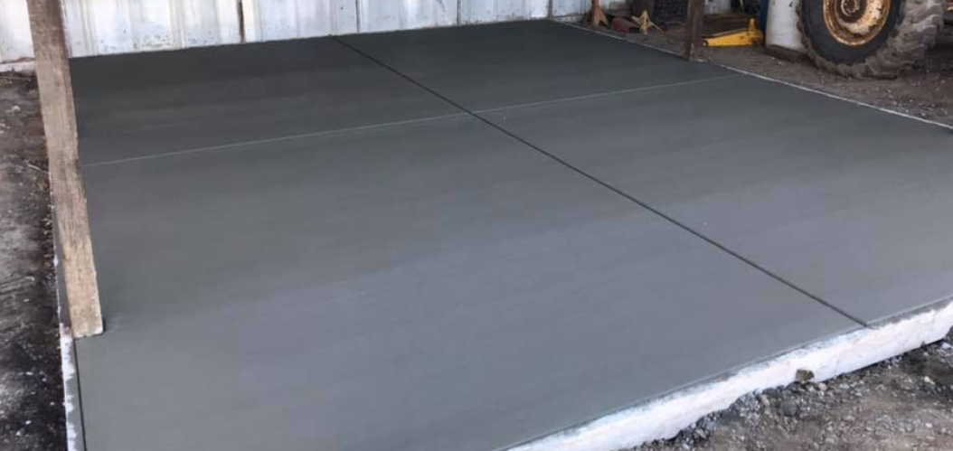 Freshly finished concrete slab with clean control joints
